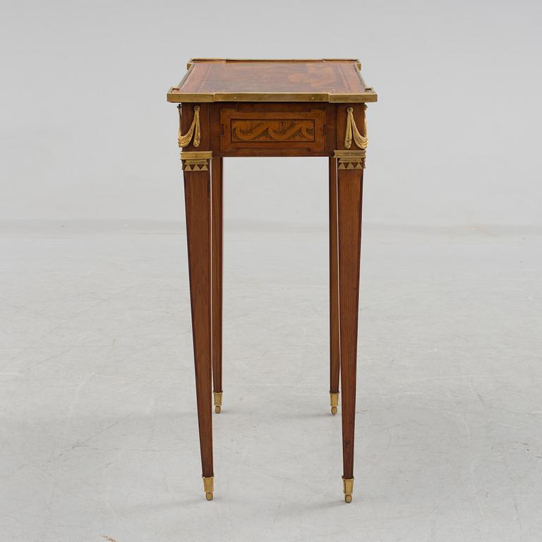 A Louis XVI-style circa 1900 occasional table.
