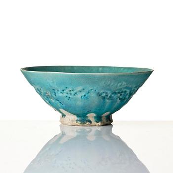 A Kashan Turquoise glazed conical pottery bowl, central Persia, 13th century.