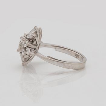 A older brilliant-, marquise-, and pear- cut diamond ring. Center diamond circa 1.20 cts.