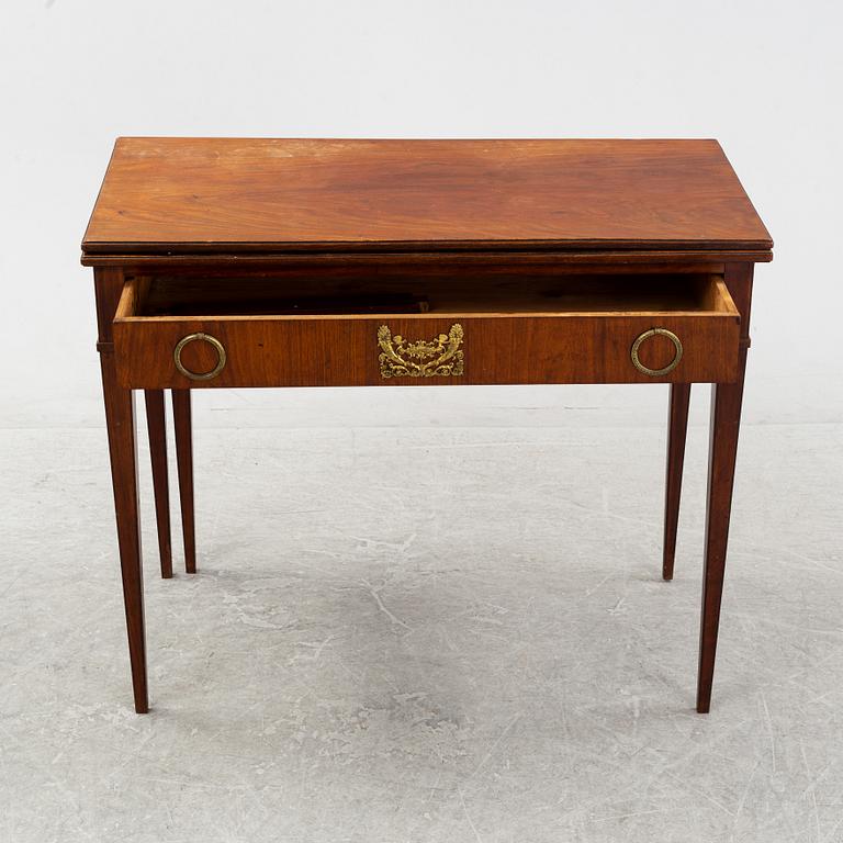 A mahogany-veneered Empire cards table, fist part of the 19th Century.