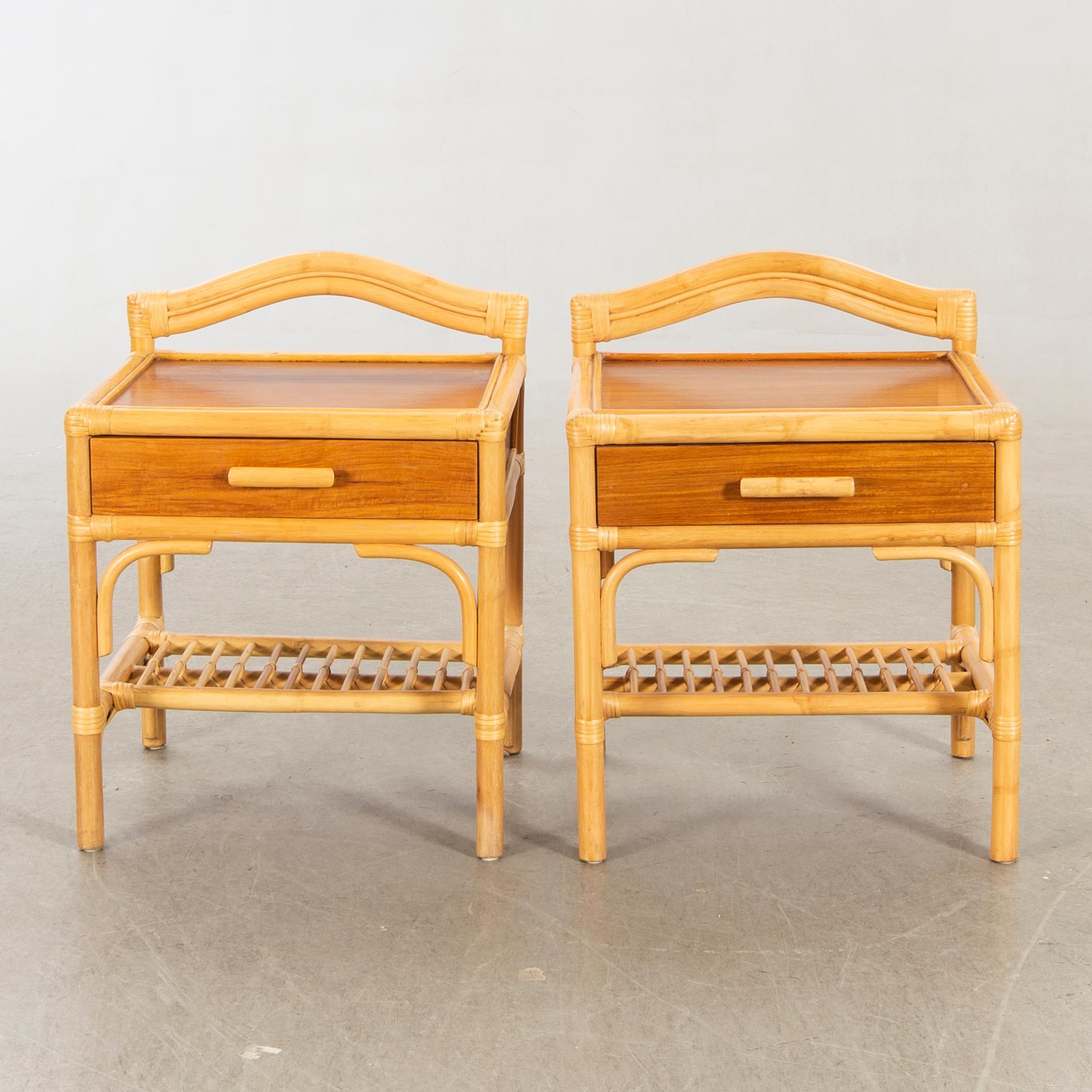 A pair of 1980s Dux rattan bedside tables.