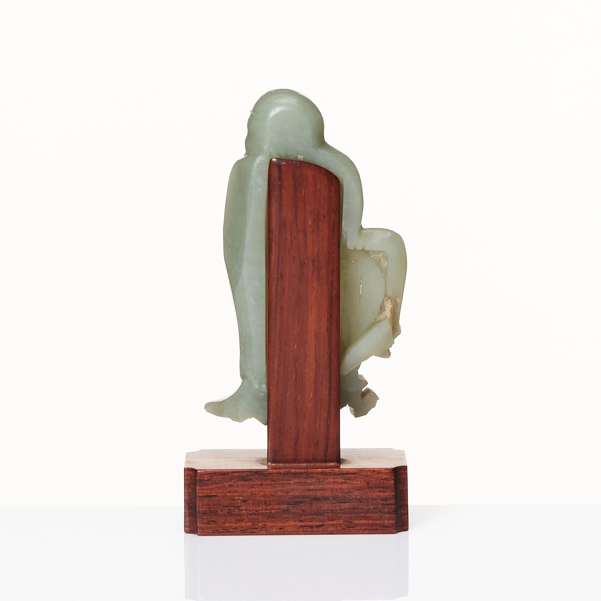 A carved nephrite sculpture of a lohan, Qing dynasty (1664-1912).