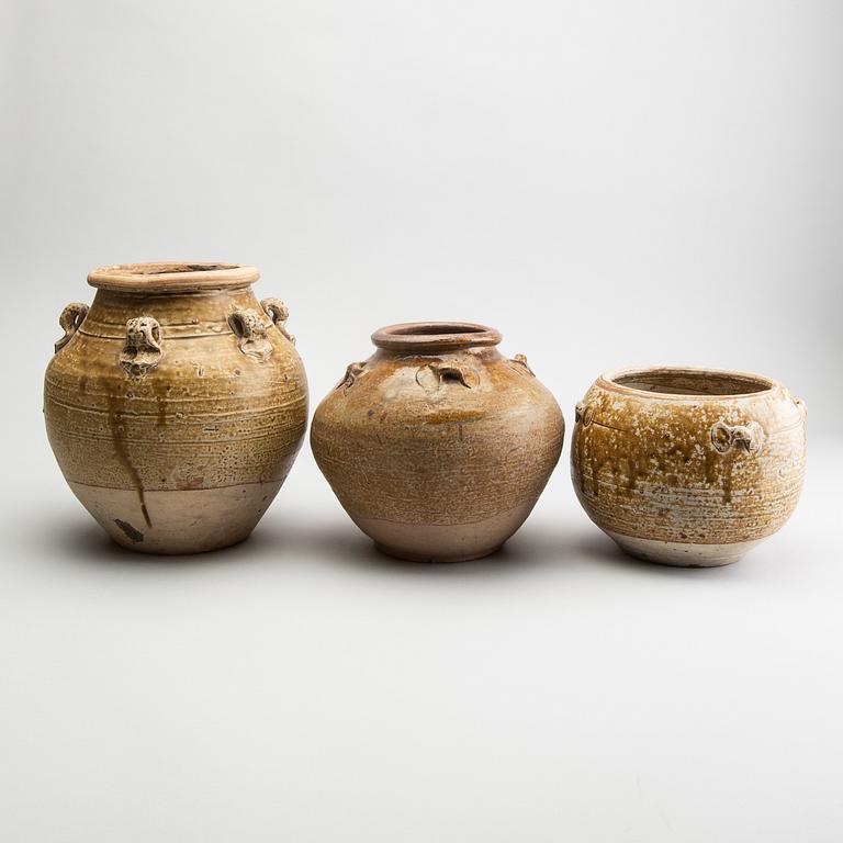 A group of three olive glazed jars, South East Asia, presumably 16th/18th Century.