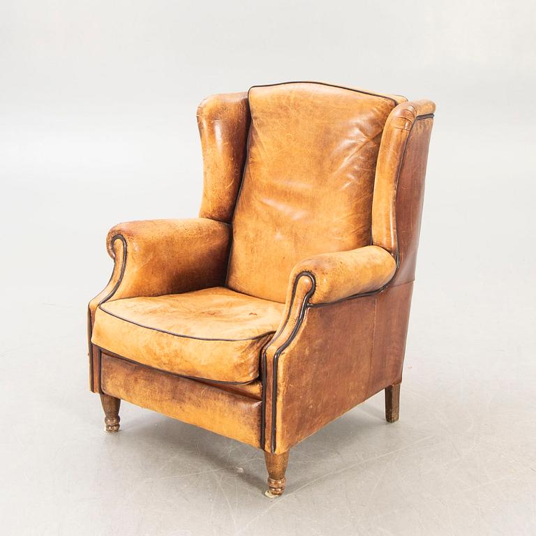 A leather armchair later part of the 20th century.