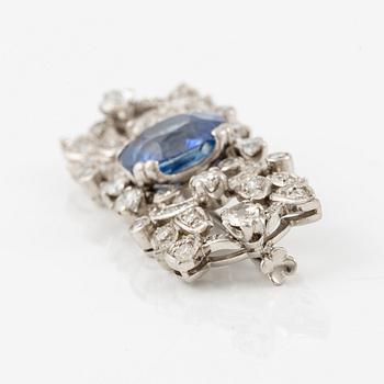 A W.A. Bolin brooch in platinum with a faceted sapphire.