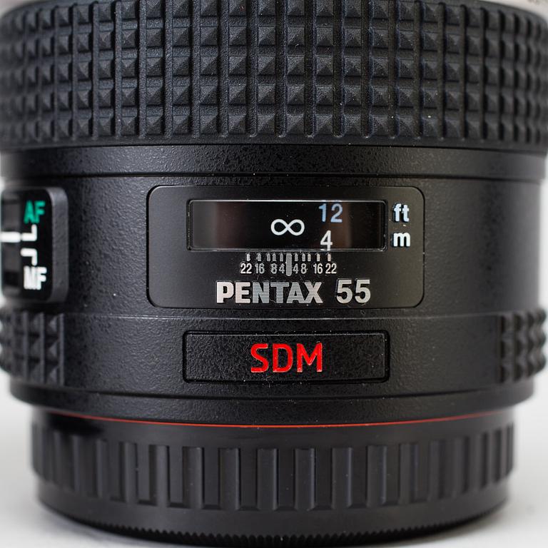 A black body medium format Pentax 645D camera with a SMC Pentax-D FA 645 55mm F2.8 AL [IF] SDM AW lens.
