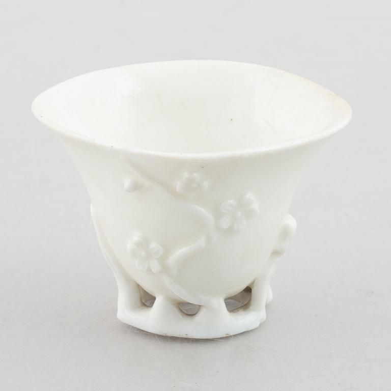 A blanc de chine rhinoceros libation cup, Qing dynasty, 18th century.