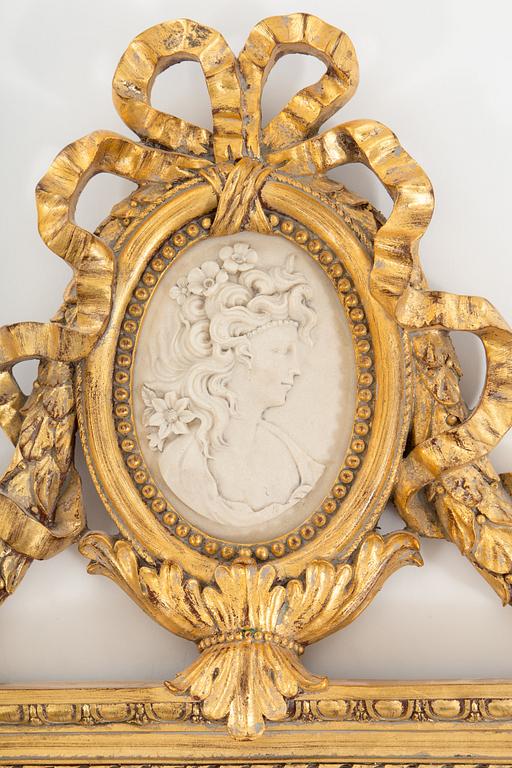 A bronzed gustavian style mirror from the second half of the 20th century.