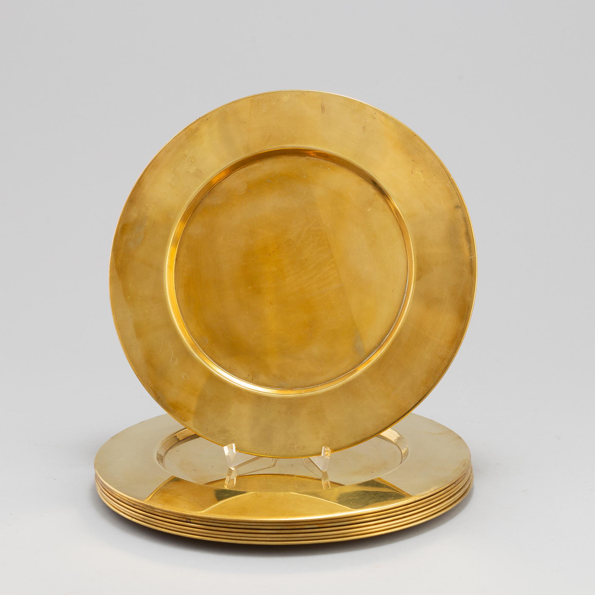 Eight brass plates by Stelton, Denmark, second half of the 20th century.