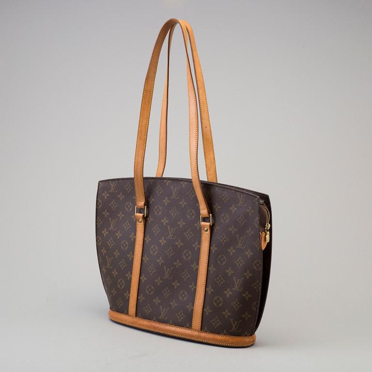 a Louis Vuitton "Babylon" bag.