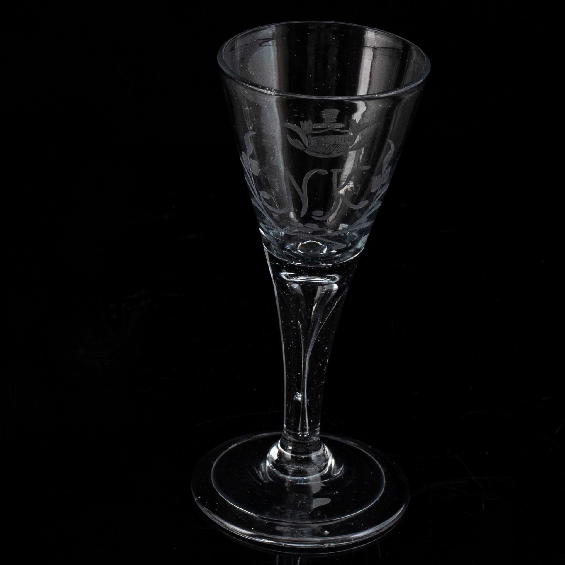 A wine glass, 18th Century, with the monogram NK beneath a noble coronet.