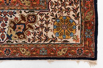 A semi-antique Tabriz carpet, c. 395 x 295 cm.