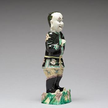 A famille noir figure of a man, Qing dynasty, Kangxi (1662-1722).