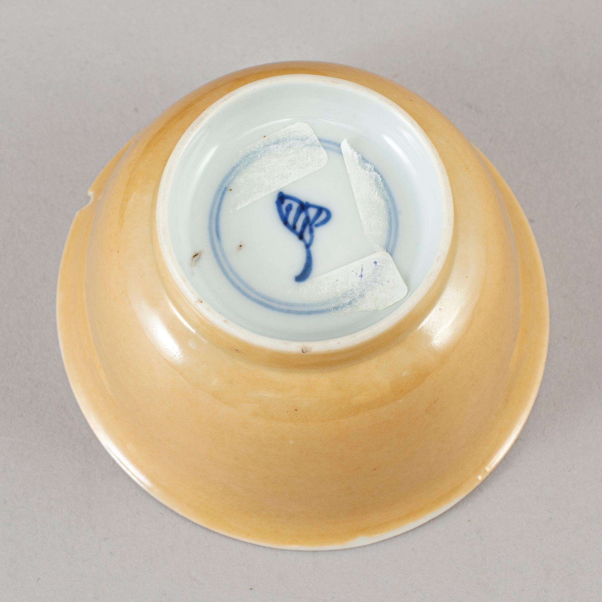 Five blue and white and cafe au lait glazed cups with dishes, Qing dynasty, Qianlong (1736-95).