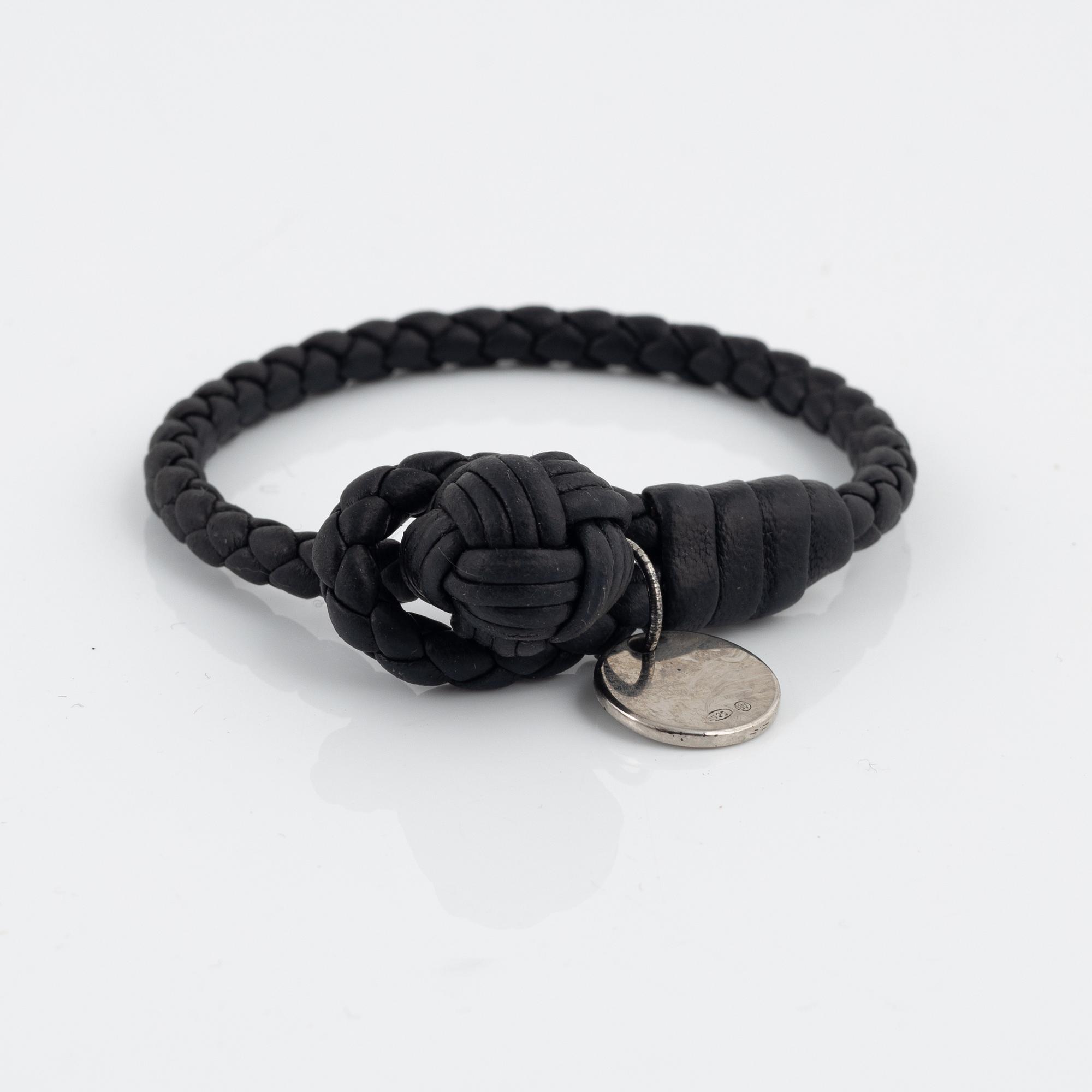 Bottega Veneta, a wallet and bracelet.