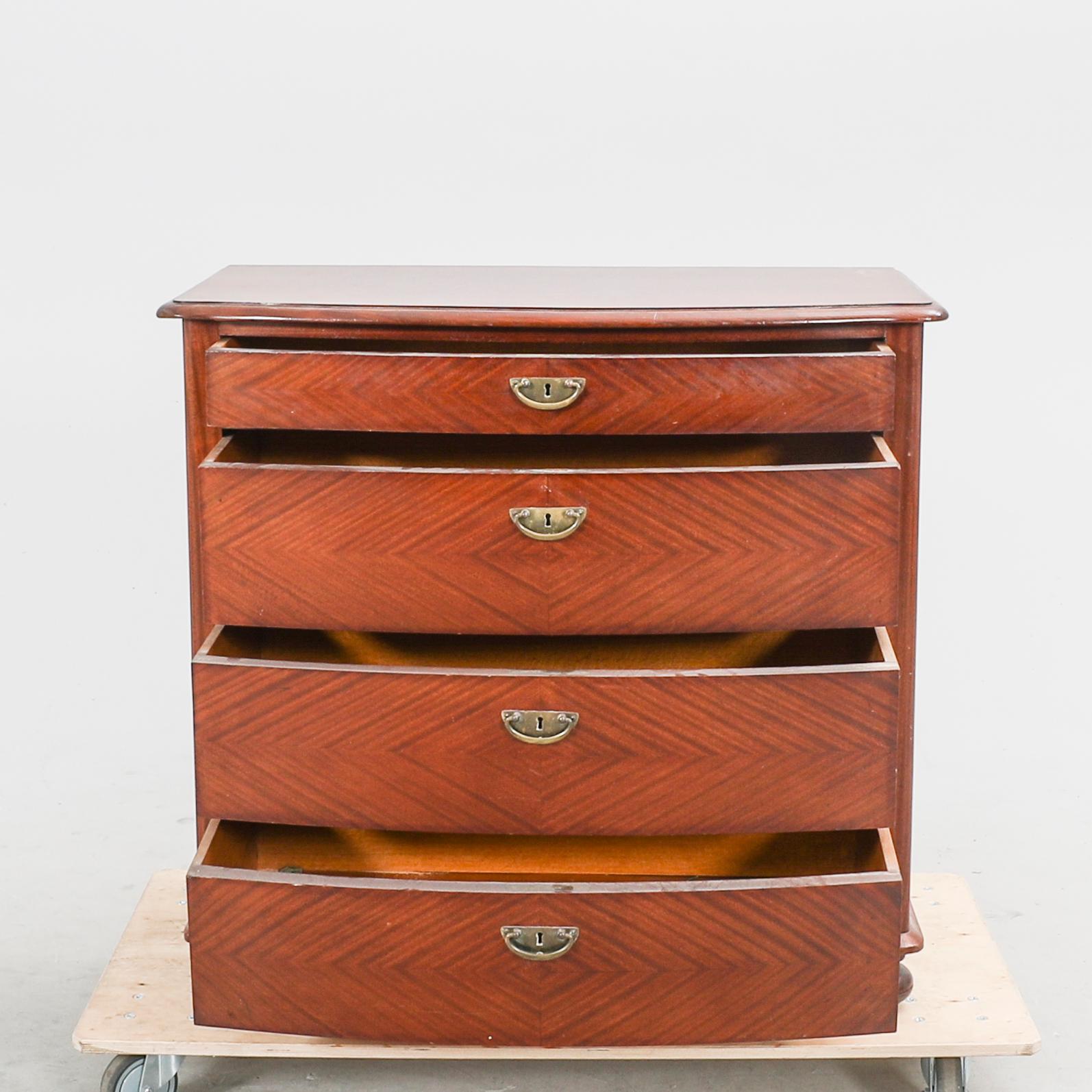 An early 1900s mahogany dresser.