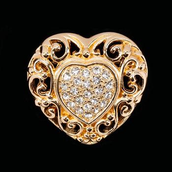 A heart-shaped golden brooch by Christian Dior.