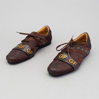 a pair of sneakers by Gianfranco Ferre.