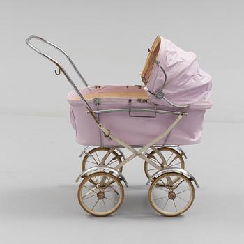 A TOY BABY CARRIAGE, 1960s.