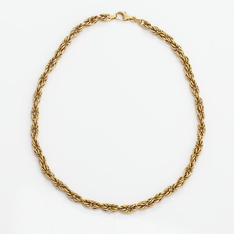 An 18K gold necklace. Unoaerre, Italy.
