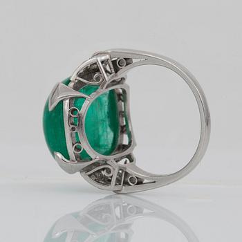 A circa 18.00 ct cabochon-cut emerald and diamond ring. Total carat weight of diamonds circa 0.30 ct.