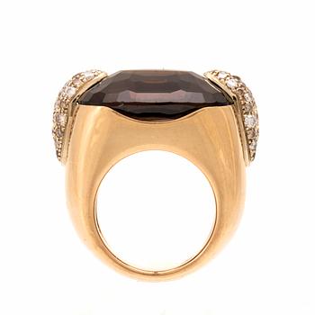 An 18K gold Pomellato "Pin Up" ring set with smoky quartz and round brilliant-cut diamonds.