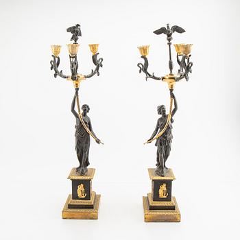 A pair (nearly) of Empire style candelabras later part of the 19th century.