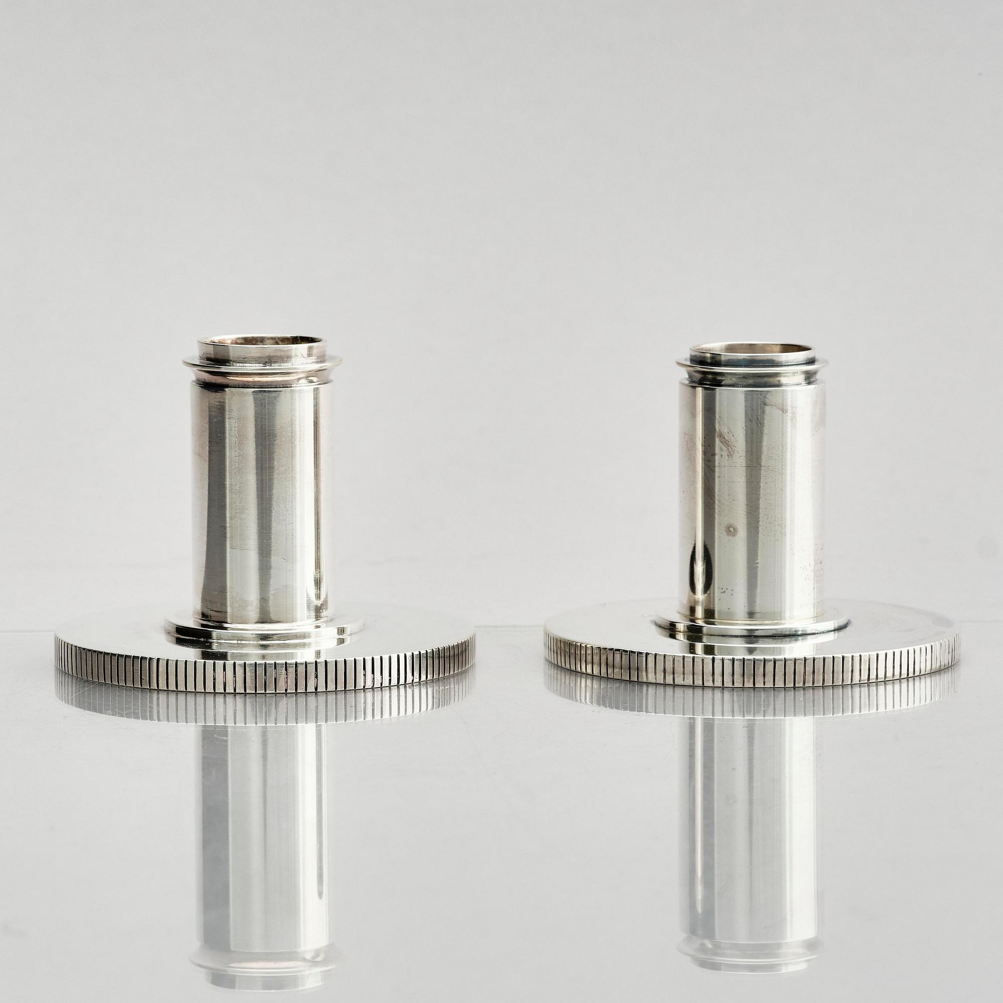 Georg Jensen, a pair of sterling silver candlesticks, design by Sigvard Bernadotte, model no 711A, Copenhagen, Denmark after 1945.