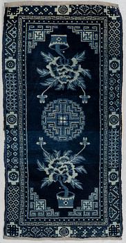 A rug, semi-antique Baotou, ca 121-122 x 59-61 cm.