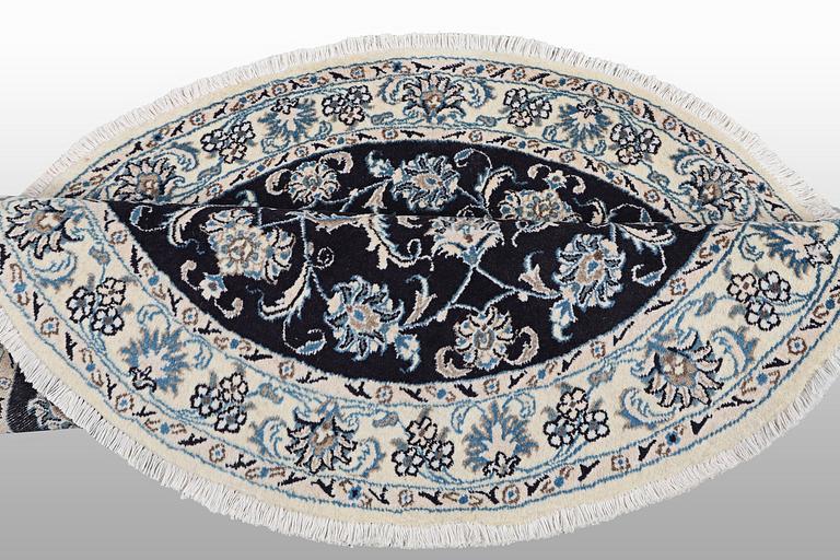 A rug, Nain, part silk, diameter ca. 140 cm.