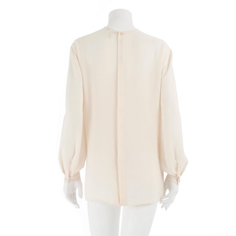 GIORGIO ARMANI, a créme colored silk blouse, size 42.