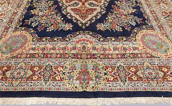 A semi-antique Kirman Laver carpet, 'Millefleur', signed, approx. 427 x 309 cm.