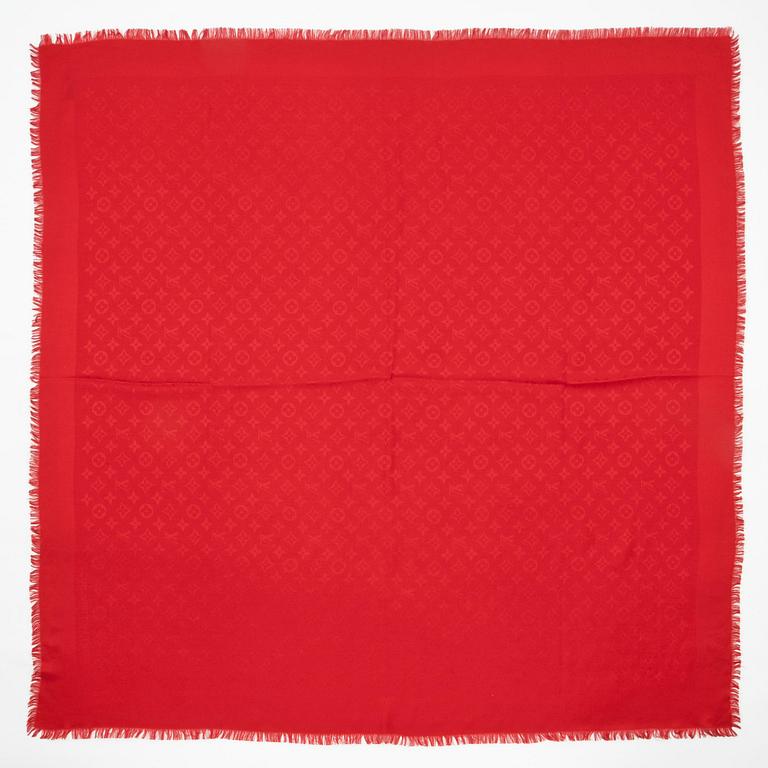 LOUIS VUITTON, a red monogrammed wool and silk shawl.