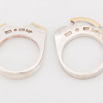 Rolf Karlsson four silver rings with gold details.