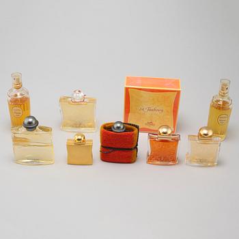 HERMÈS, seven factices and one perfumebottle.