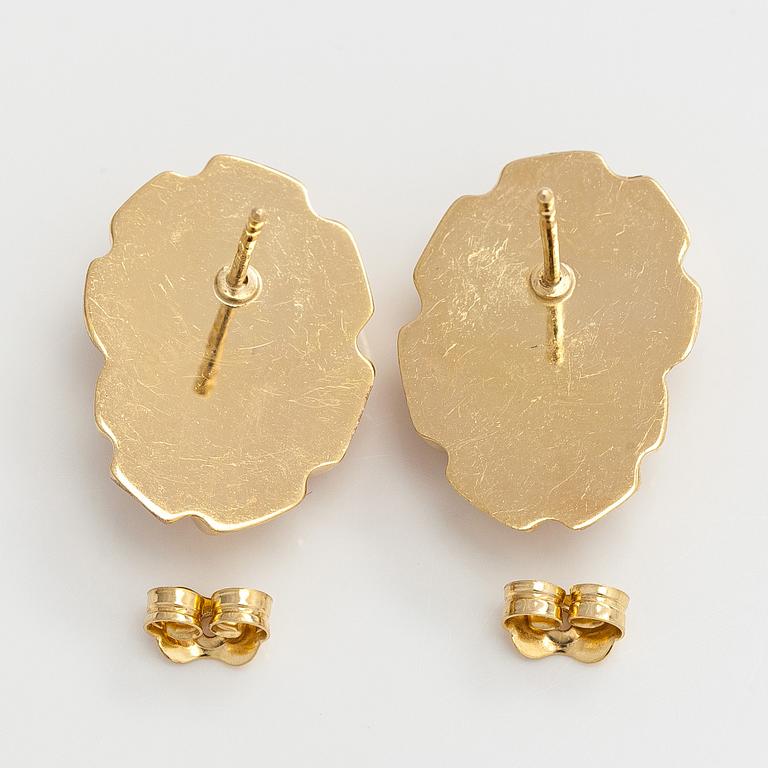 A pair of 14K gold earrings.