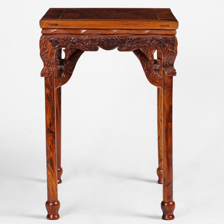 A Chinese huali square table with a lotus-leaf waist, 20th century.