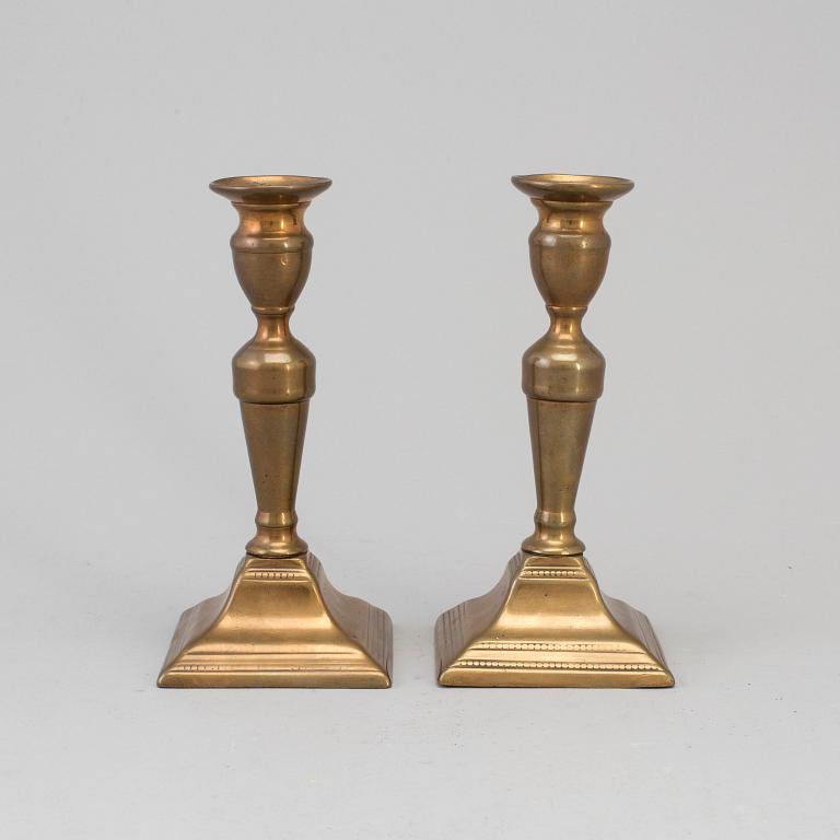 A PAIR OF BRONZE CANDLESTICKS, first half of the 19th century.