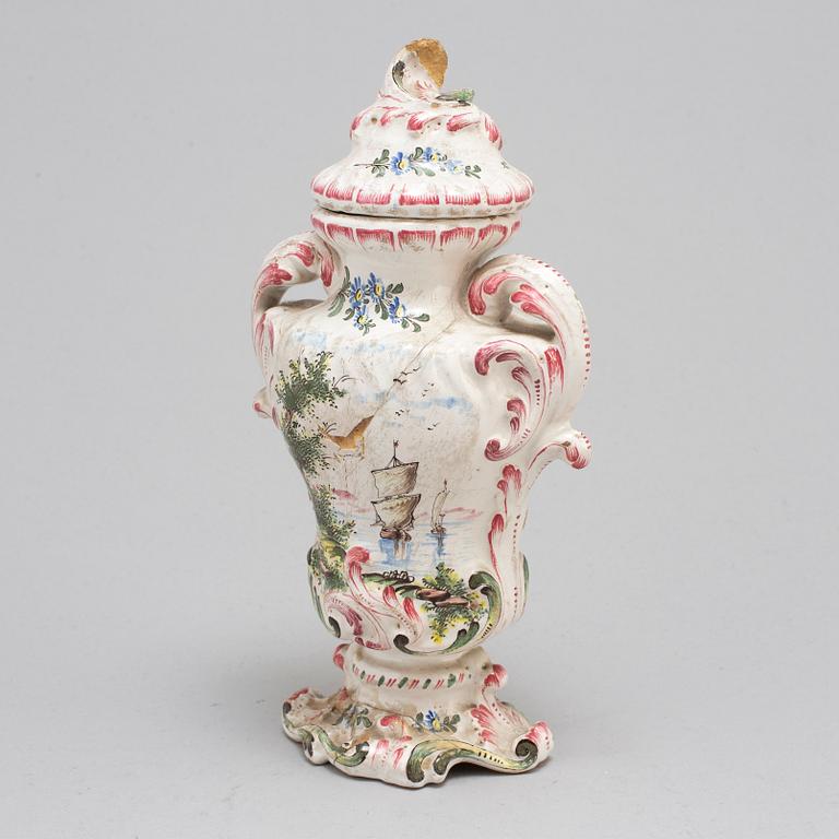 A Rococo faiance vase with cover, mid 18th century.
