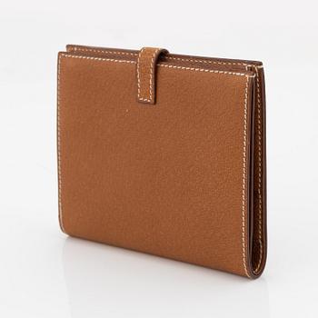 Hermès, a brown leather gold lock wallet.