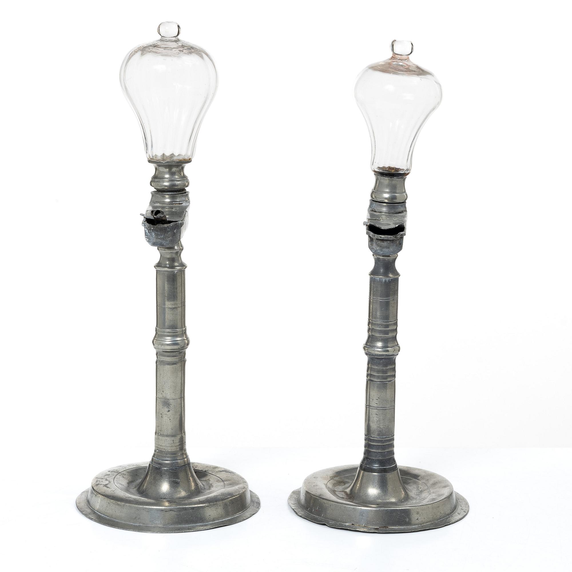 Oillamps, two similar, 19th century.