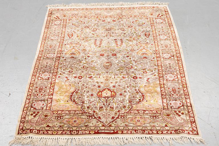 A rug, Old silk Hereke, ca 152 x 110 cm.