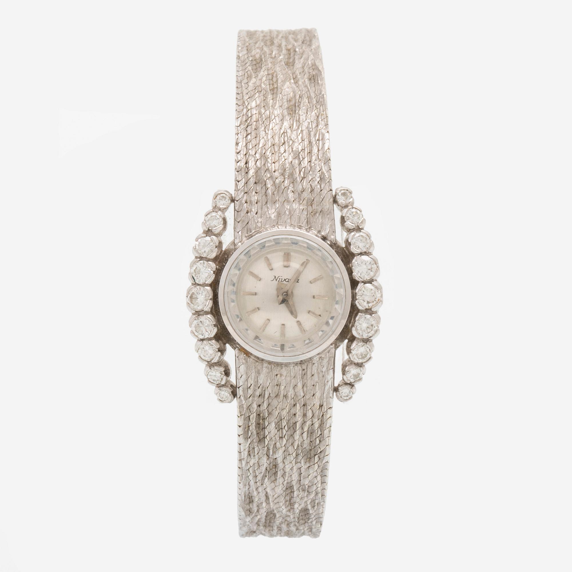 Nivada armbandsur 12,2 mm, 18K vitguld och runda briljantslipade diamanter.