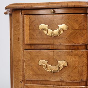 A late Baroque walnut-veneered chest of drawers attributed to J. H. Fürloh (master in Stockholm 1724-1745).