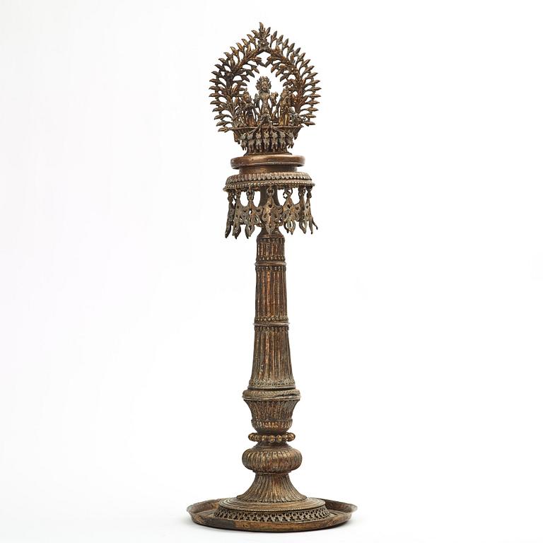 A copper alloy temple lamp, Nepal, circa 1900.