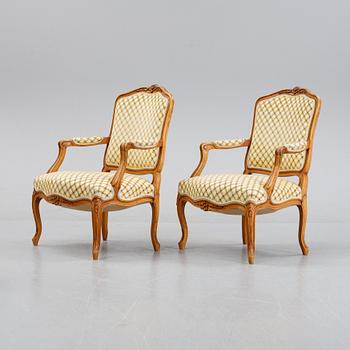 A pair of rococo style armchairs, early 20th Century.