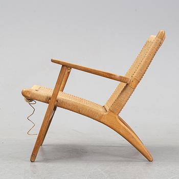 A 'CH-25' armchair designed by Hans J Wegner for Carl Hansen & Søn, Denmark.