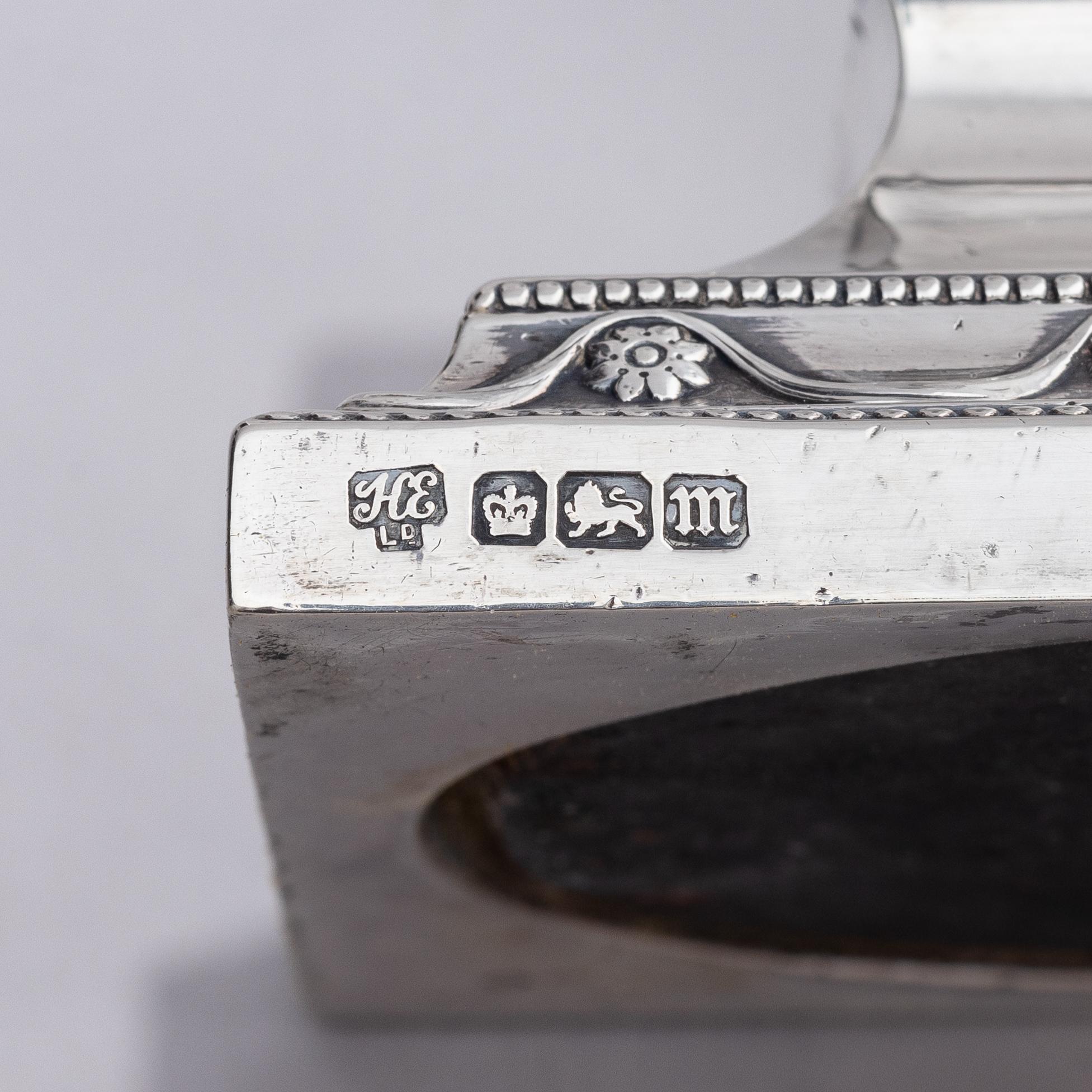 Four early 20th century silver candlesticks, marks of Hawksworth, Eyre & Co Ltd, Sheffield, England 1904-1906.