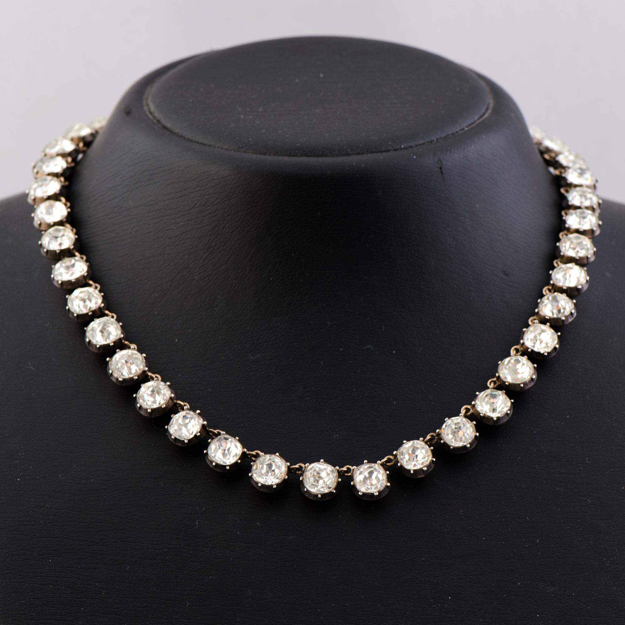 A  RIVIERE NECKLACE, facetted glass, silver, 19th century.