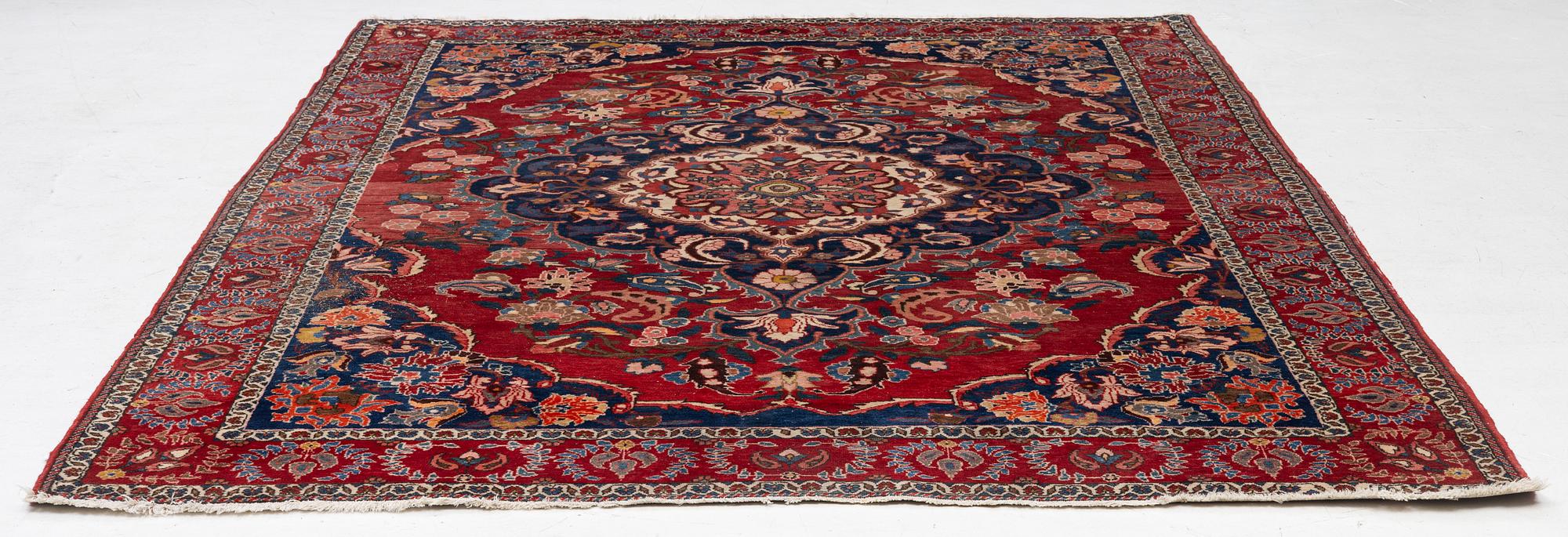 An Persian carpet, ca. 310 x 215 cm.